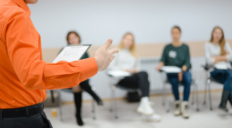 Lecturer conducts a lecture, training.